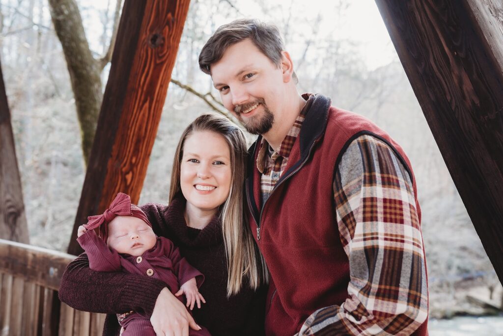Power employee poses for a photo with her family including her newborn baby. 